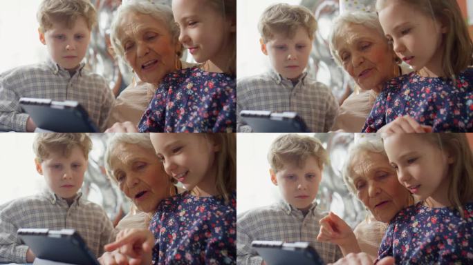 奶奶和孩子在家玩平板电脑