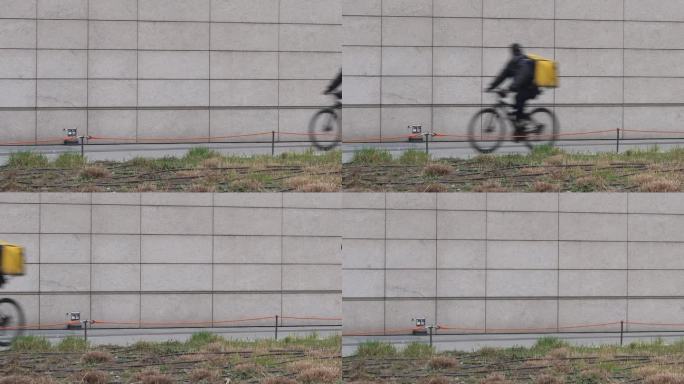 骑手骑着自行车经过，外卖在城市的视频里