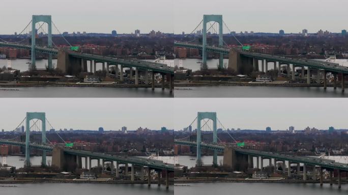 在多云的日子里，纽约长岛海峡上空鸟瞰Throgs Neck大桥。摄像车左移右移。