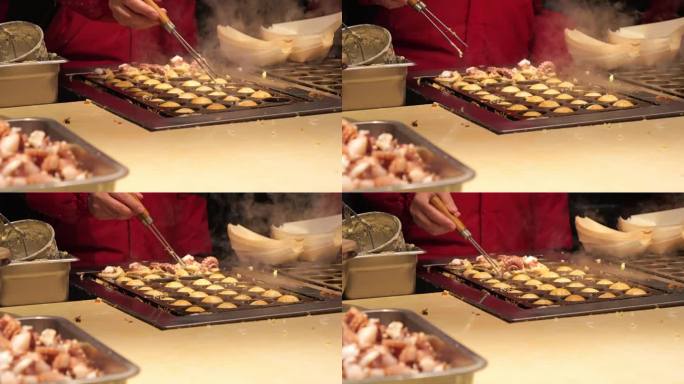 章鱼烧的制作。章鱼烧或章鱼球是夜市和步行街的一种日本食品。中国。