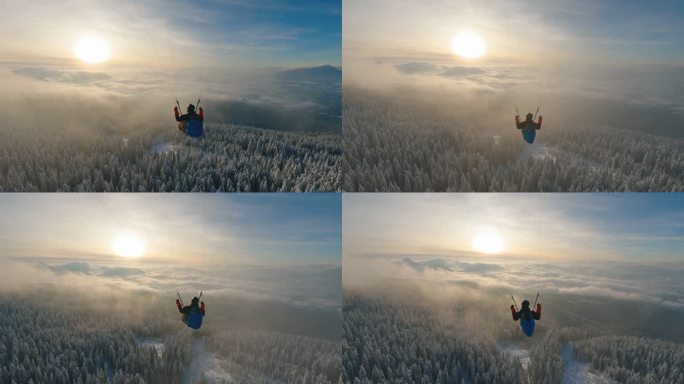 滑翔伞飞越雾蒙蒙的云层