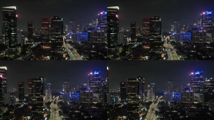 夜间照明雅加达市区现代办公大楼交通街道道路航拍全景4k印尼