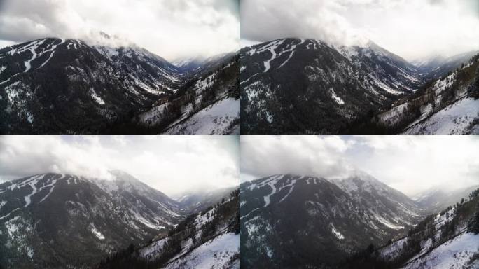 白杨高地延时阿贾克斯滑雪道运行酪乳雪堆栗色钟金字塔峰落基山脉冬季灰色多雪多云运动风景优美的景观