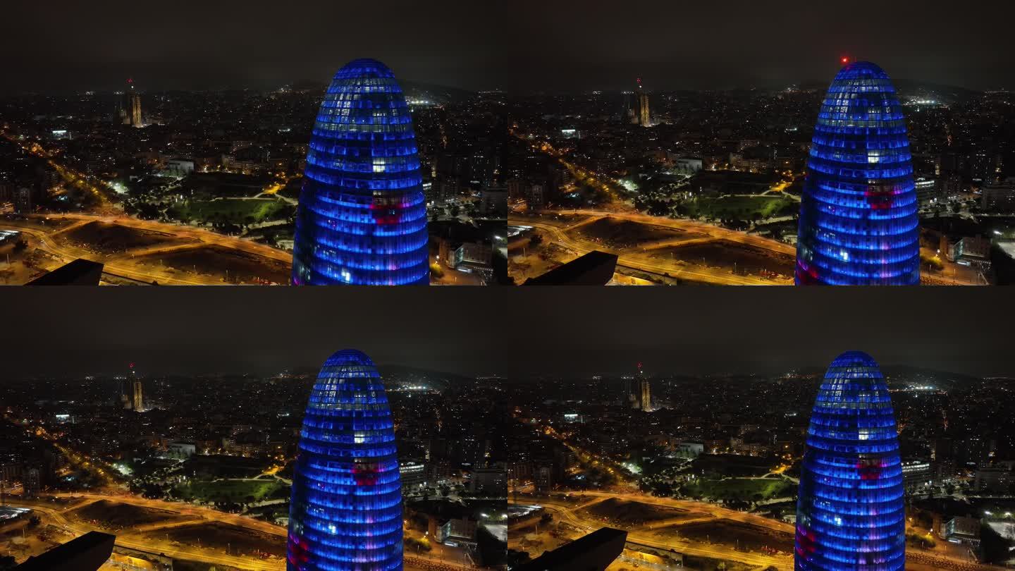 夜间照明巴塞罗那市著名的办公大楼顶部外部交通街道航拍全景4k西班牙