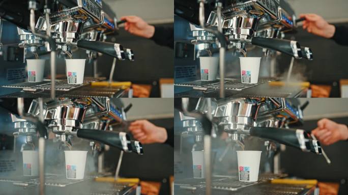 餐车里咖啡机的热气和咖啡师用倒进杯子的咖啡制作牛奶的特写