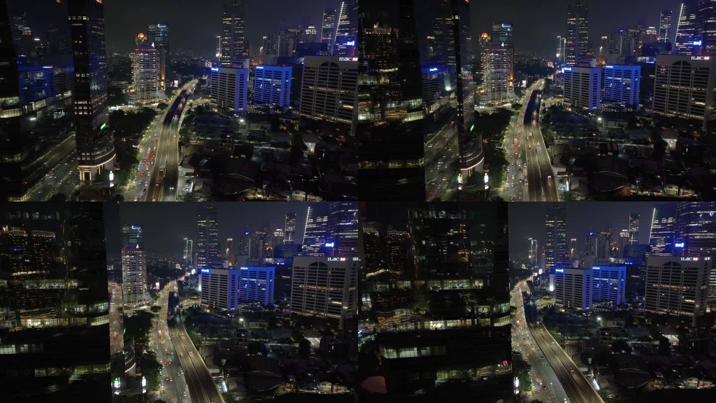 夜间雅加达市现代市中心交通街道道路航拍全景4k印尼