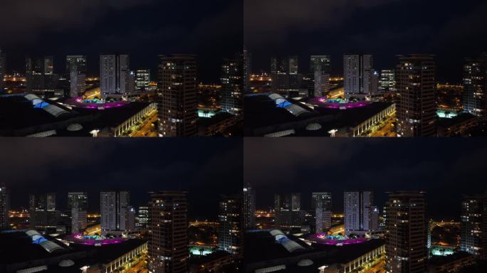 夜间照明巴塞罗那市现代住宅楼商场屋顶航拍全景4k西班牙