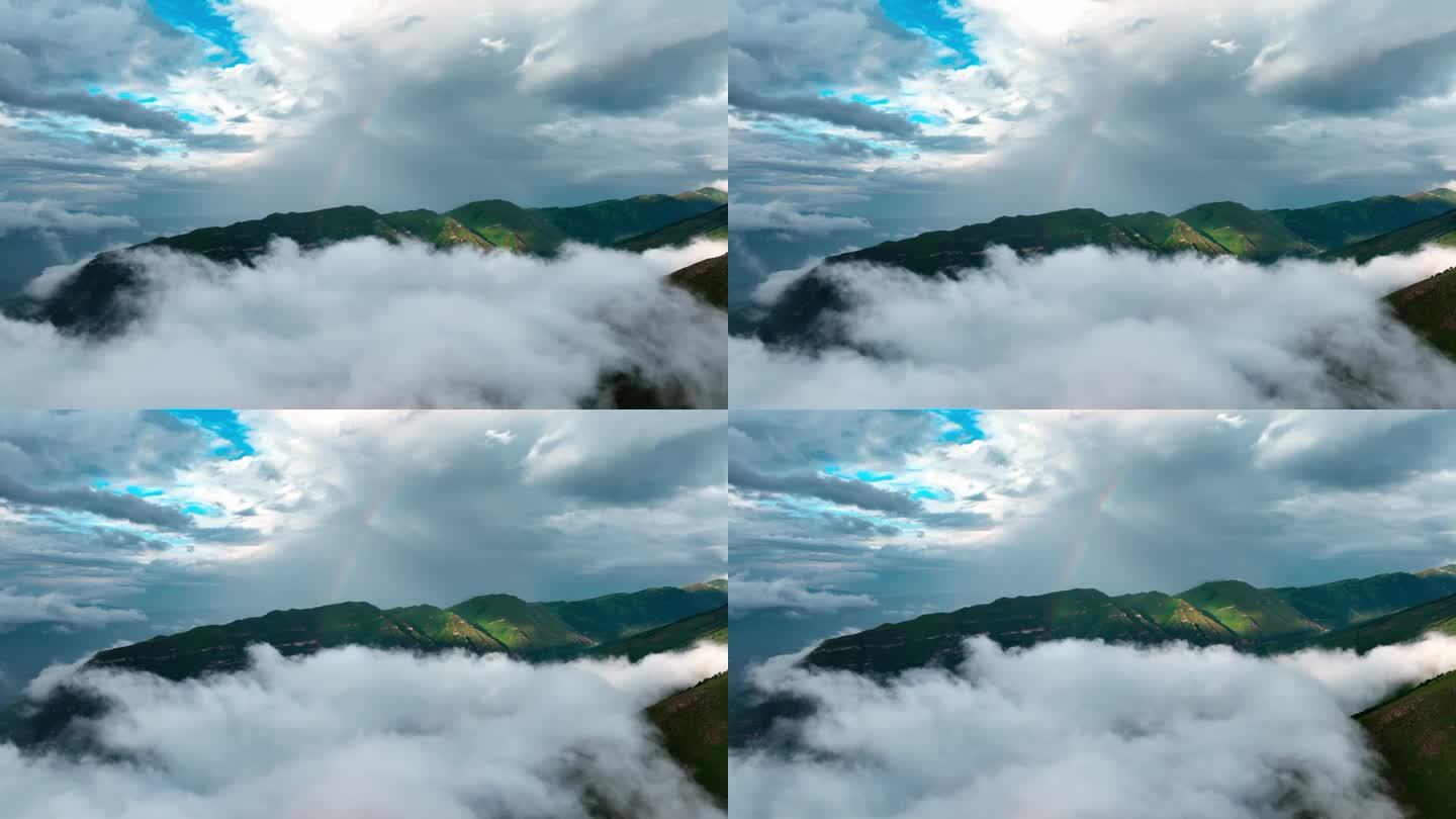 云中出现的山峰有彩虹。云中出现的山峰有彩虹