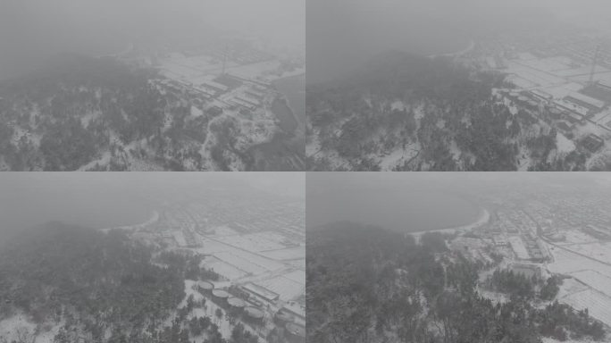 航拍山东荣成俚岛烟墩角村烟墩山冬季雪景