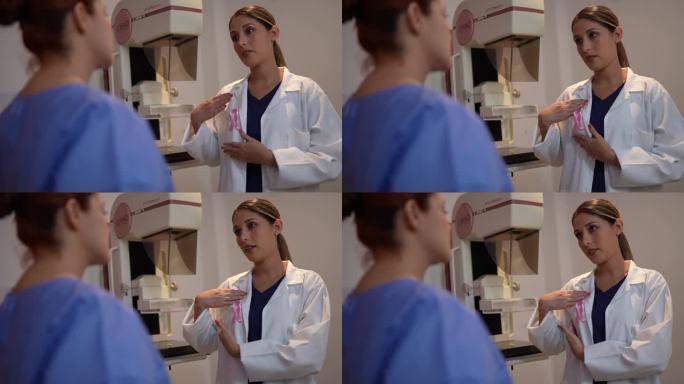 在医院的乳房x光照相室里，医生教病人触摸乳房