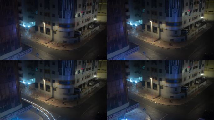 夜间迪拜城市交通街道十字路口屋顶全景4k延时阿联酋