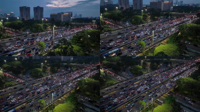 日落天空夜晚照明雅加达市中心交通街道道路交汇处航拍全景4k印度尼西亚