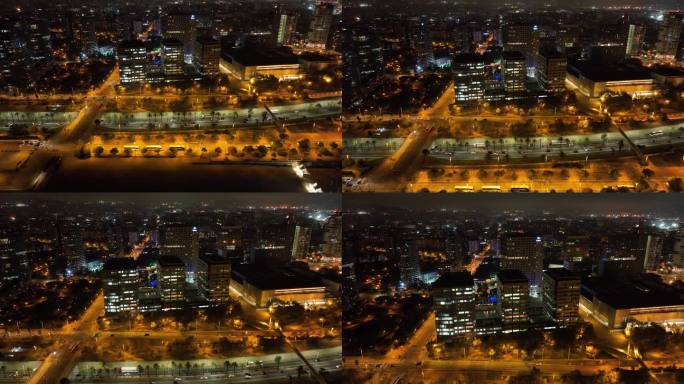 夜晚照亮巴塞罗那市办公大楼交通街道海湾路航拍全景4k西班牙