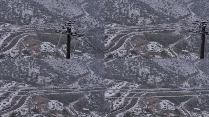 山区农村电力电线输电网冬天积雪结冰冻雨