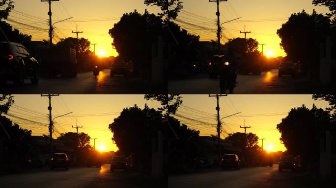 傍晚的夕阳落在小区里，汽车在乡间小路上来来往往。