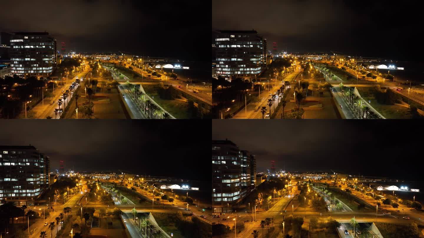 夜间照明巴塞罗那城市交通海湾道路航拍全景4k西班牙