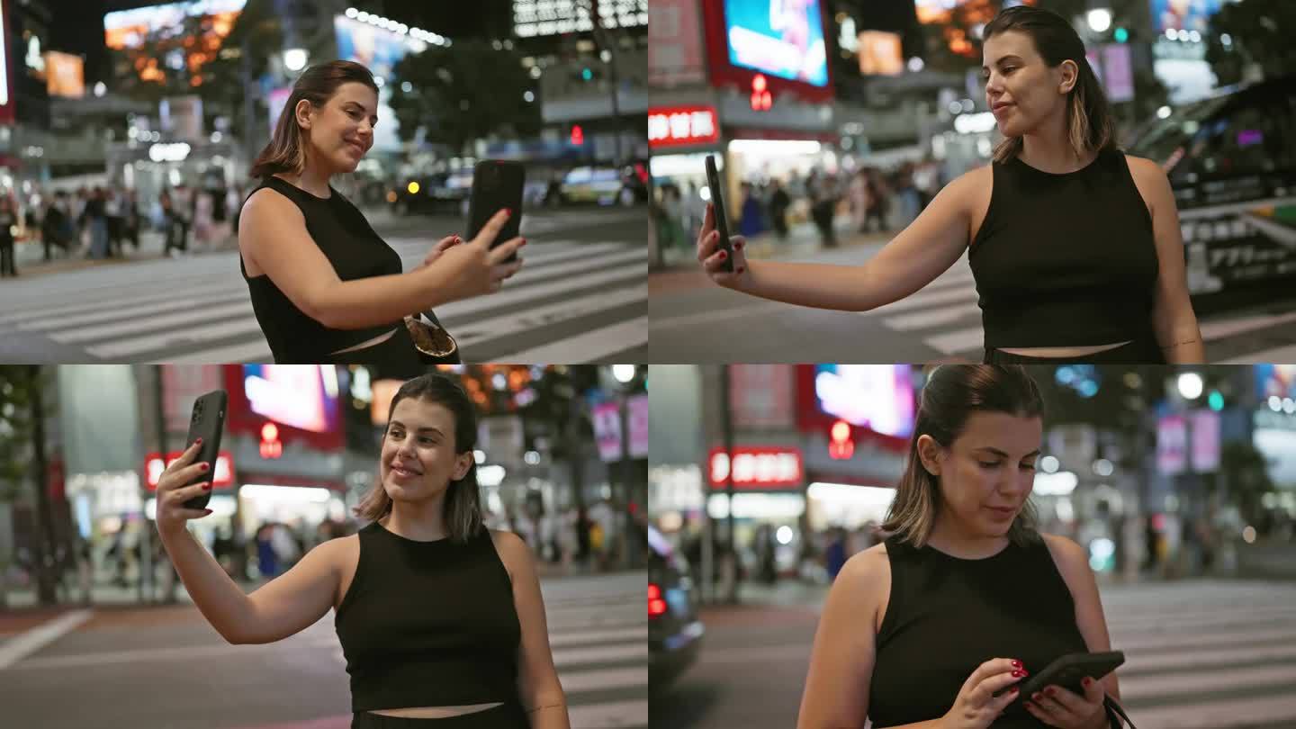 微笑的西班牙裔女子，在夜晚东京明亮的城市街道上随意地自拍了一张美丽的自拍照，体现了城市科技旅游的乐趣