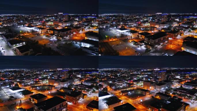 夜间，北达科他州法戈市中心，用左潘向右上升的无人机拍摄