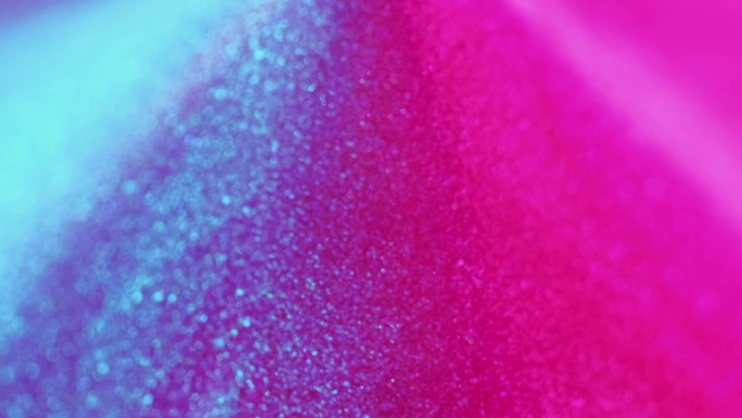闪光液体飞溅墨水溢出霓虹粉红色蓝色滴
