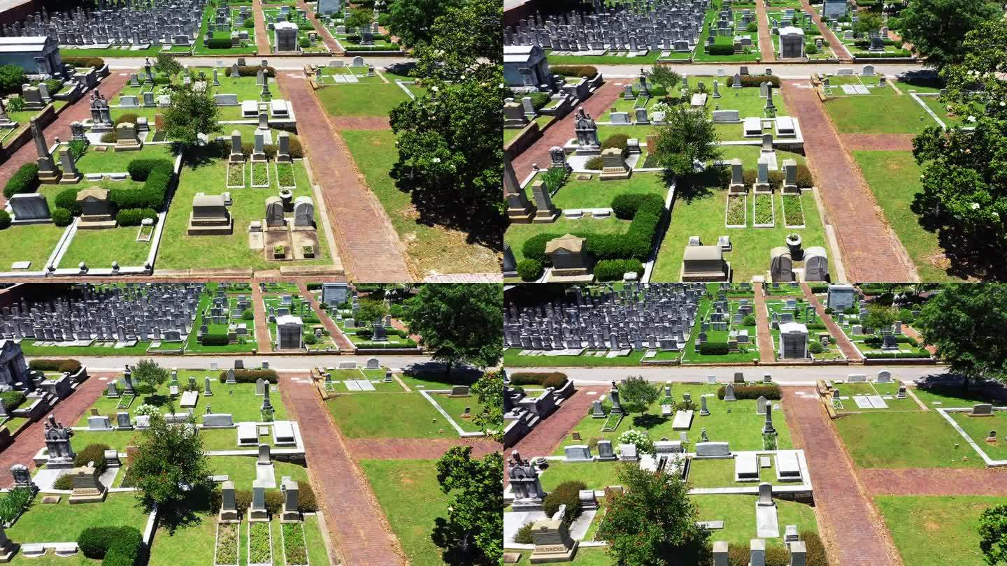 向前飞过绿色草坪上的坟墓。镇上公墓里一排排的墓碑。最后的安息之地。亚特兰大，佐治亚州，美国