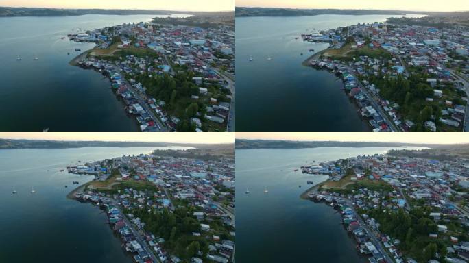 全景无人机日落佩德罗蒙特帕拉菲托斯湾在卡斯特罗，日落，原始的水与巴塔哥尼亚岛镇