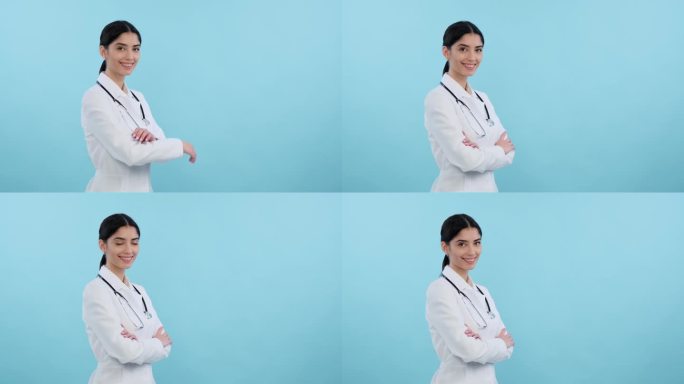 一个微笑的女医生在蓝色背景上的肖像