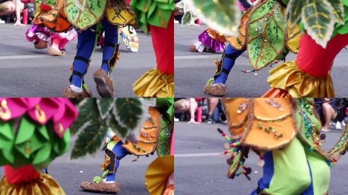 在一年一度的椰子节庆祝活动中，街头舞者穿着各种当地和色彩缤纷的土著服装，沿着街道疯狂表演，向守护神致