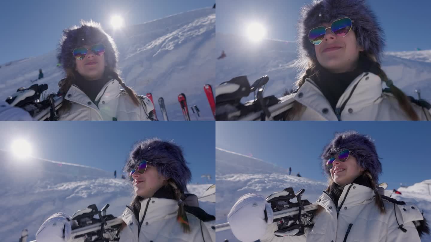 一个酷酷的年轻女子在高山滑雪胜地拿着她的滑雪板的肖像