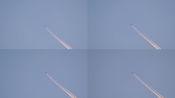 一架客机在遥远的蓝天上高空飞行，留下了白色的烟雾痕迹。航空运输概念