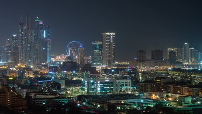 夜间照明著名的迪拜码头区摩天轮屋顶全景4k延时阿联酋