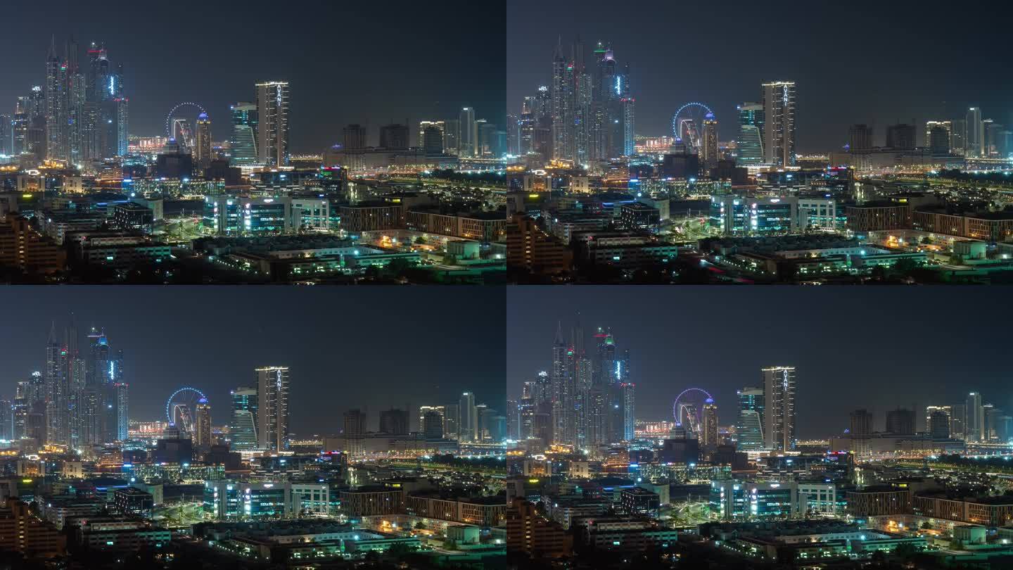 夜间照明著名的迪拜码头区摩天轮屋顶全景4k延时阿联酋