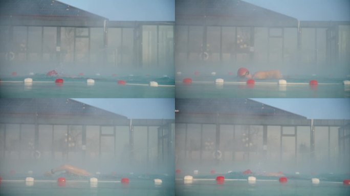 SLO MO坚定的女游泳运动员在黎明时分在豪华旅游度假村雾池练习自由泳