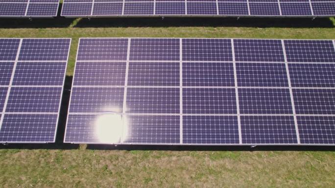 为生产清洁绿色生态电力而安装太阳能电池板的蓝色光伏表面鸟瞰图。生产不影响环境的可再生能源。