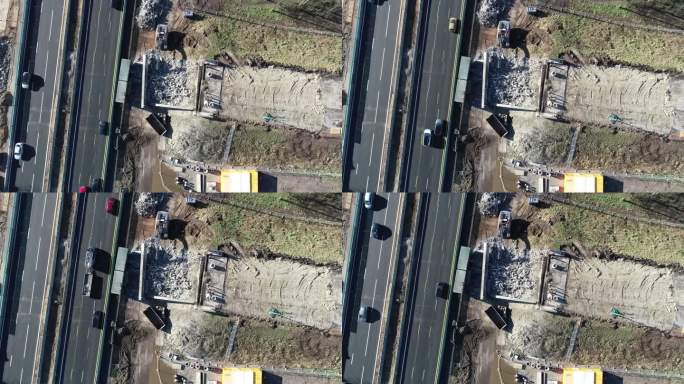 静态无人机在高速公路和建筑工地相邻的鸟瞰图中拍摄。