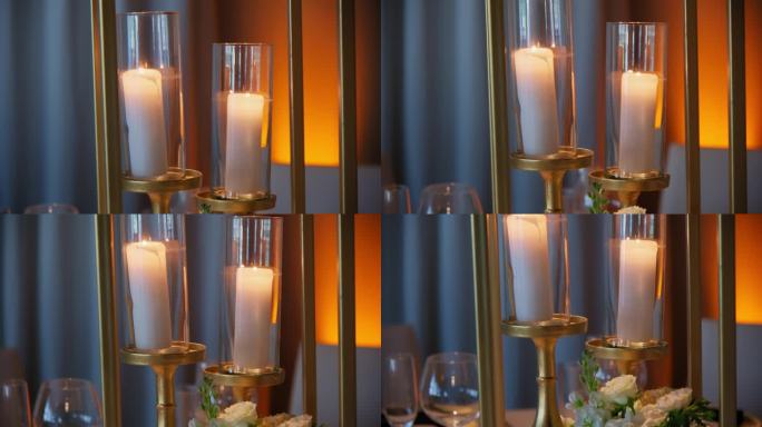 餐厅里摆满蜡烛的特写镜头。婚礼事件