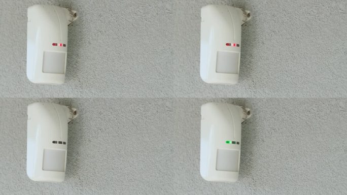 房子墙上的运动传感器。LED指示灯亮起以检测运动