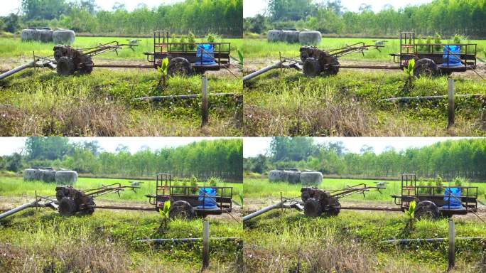 农民用拖拉机把水灌入田地。