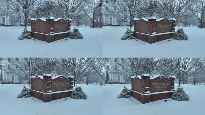 宾夕法尼亚州葛底斯堡学院的砖招牌。雪落在美国大学校园里。学术界的主题。