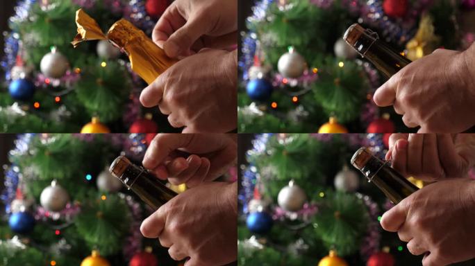在装饰着闪闪发光的花环的圣诞树的背景下，一瓶香槟正在被打开。慢动作