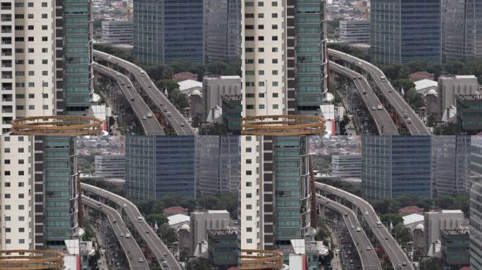 白天飞行在雅加达市中心的交通街道道路航拍全景4k印尼