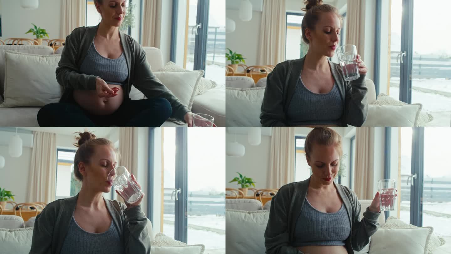 白人孕妇坐在沙发上吃营养补充剂