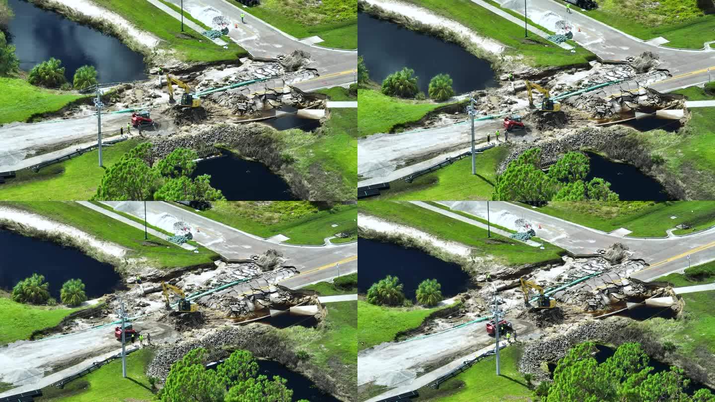 航拍图:洪水冲走沥青后被河水冲毁的公路桥重建图。重建被毁坏的交通基础设施