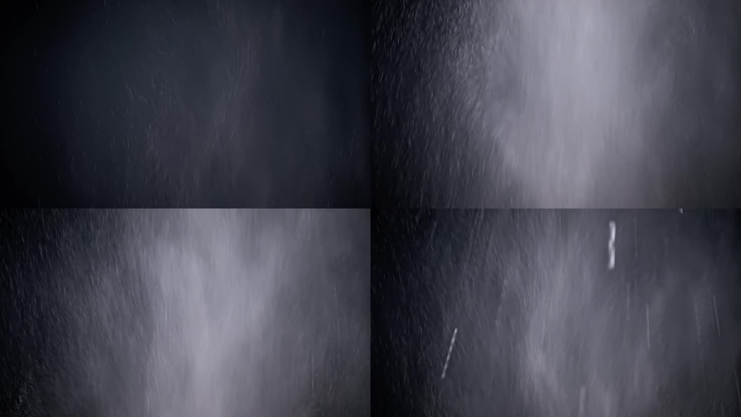 爆炸的混合粒子的水，灰尘在黑色的背景。慢动作