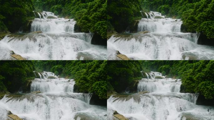阿利瓦瓦格瀑布阶梯状岩层自上而下的慢动作鸟瞰图。