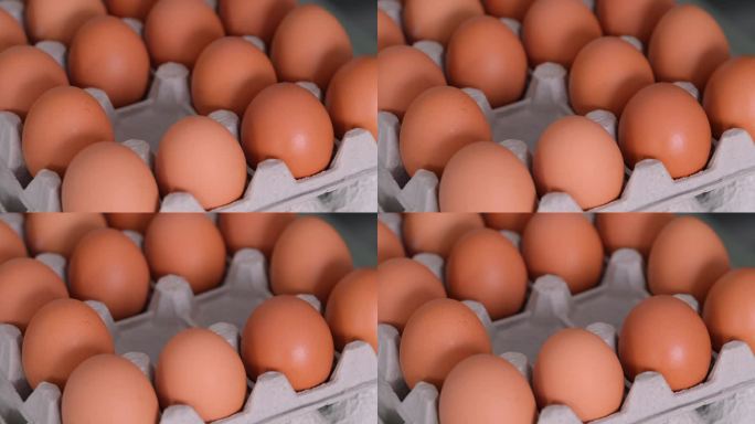一位妇女从一盒鸡蛋中取出三个鸡蛋