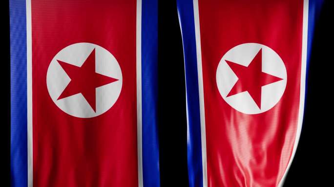 卷成圆柱形的朝鲜国旗在旋转时展开并起伏