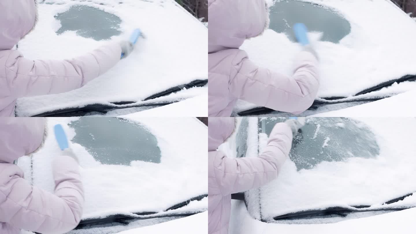 一位妇女正在用刷子清理她的汽车上的积雪。清洁风挡玻璃