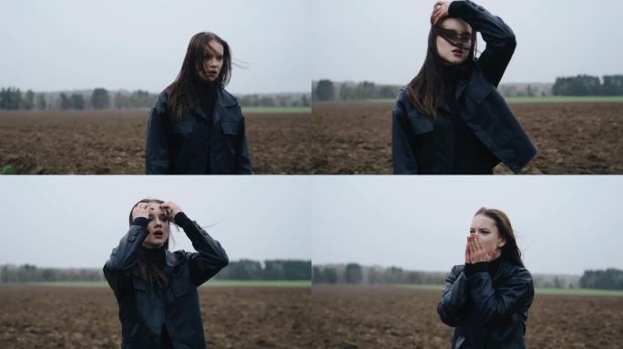一个站在田野里的女孩带着沮丧的表情和情绪回头看。雪落在上面，风在吹。悲伤和坏心情的气氛