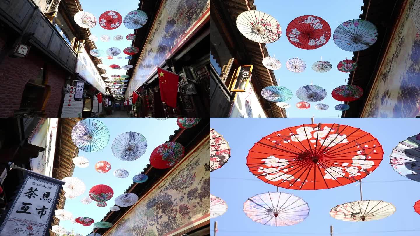 云南 束河古镇 街道上悬挂着的花纸伞