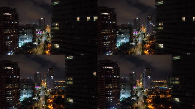 夜间照明巴塞罗那城市现代住宅商场屋顶交通街道航拍全景4k西班牙
